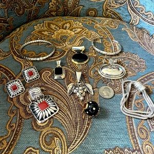 Silver Metal Jewelry Assortment of bracelets, slides, and earrings